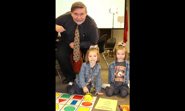 Gary Anderson watches students work